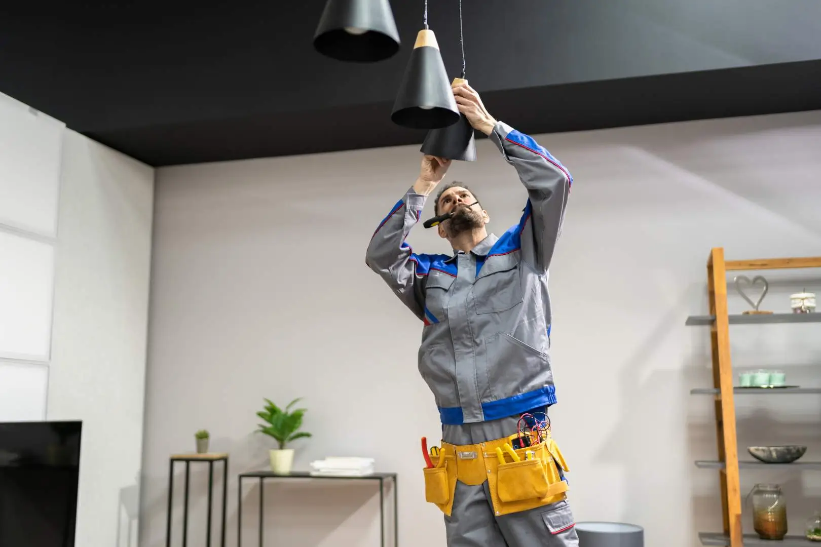 Electrician – Blacktown – tradesperson installing modern pendant lighting in a residential property.